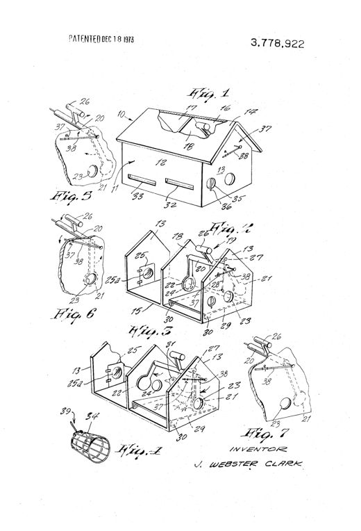 Line drawing of a purple-martin-style birdhouse trap with a peaked roof, two entrance slots on the front wall, and an internal partition dividing it into two chambers, with a pivoting rod and paddle mechanism, counterweight, and an external wire indicator visible on the roof and end wall.