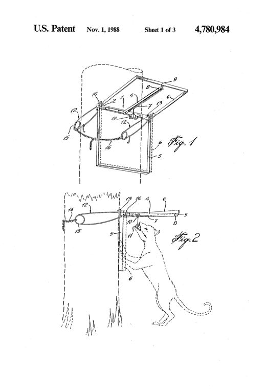 Perspective line drawing of a rectangular wire-frame animal trap mounted vertically against a tree trunk, showing a fixed V-shaped jaw, a hinged U-shaped movable jaw, a bait-triggered detent lever, and coiled spring wires with a chain wrapping around the tree to hold the trap in place.